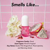 Pink bottle with dragonfruit and flowers on a pink tiled background