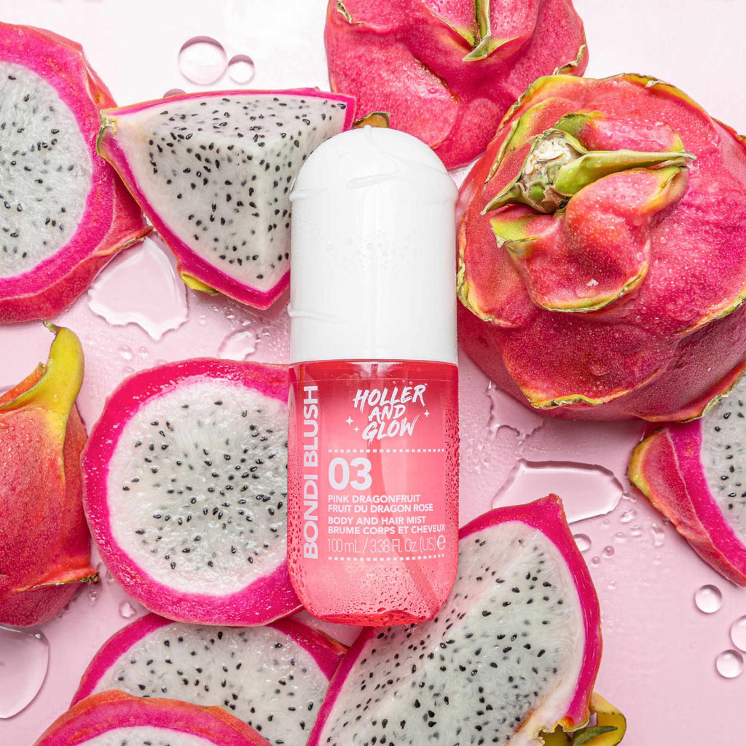 Bottle of Holler and Glow product surrounded by dragon fruit slices on a pink background
