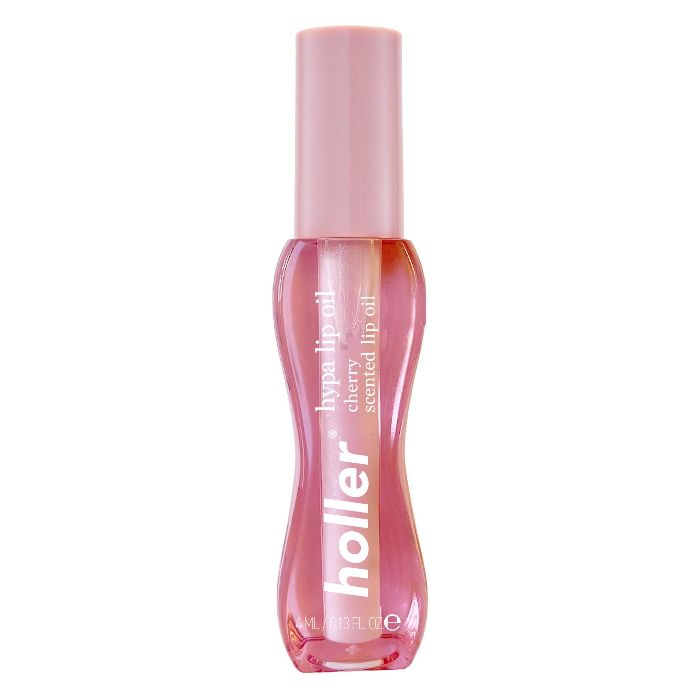 Pink lip oil bottle with 'holler' branding on a white background