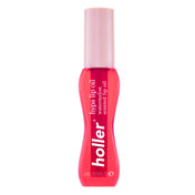 Lip oil bottle with pink cap and red body on a white background